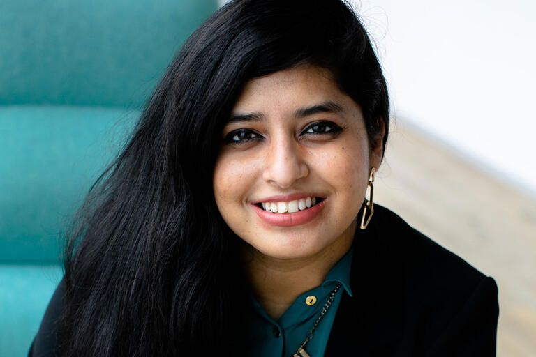 Sabhanaz Rashid Diya with blue chair in background